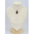Pendentif oval Oeil de Tigre rouge facetté - Bijoux en Oeil de Taureau