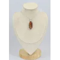 Pendentif oval en bois pétrifié - Bijoux en Bois pétrifié