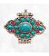 Pendentif bouddhiste Ghau en métal blanc, fabriqué au Népal.