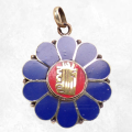 Pendentif tibétain Kalachakra – Fleur métal & résine du Népal