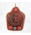 Pendentif Bouddha antique en métal vieilli avec pierres.