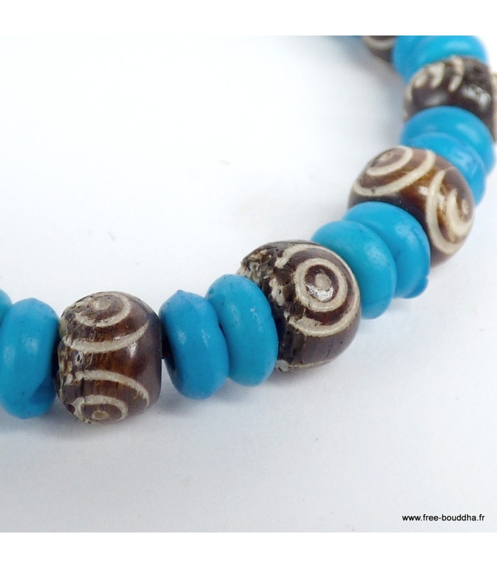 Bijou tibétain artisanal – Perles bleues et spirales symboliques