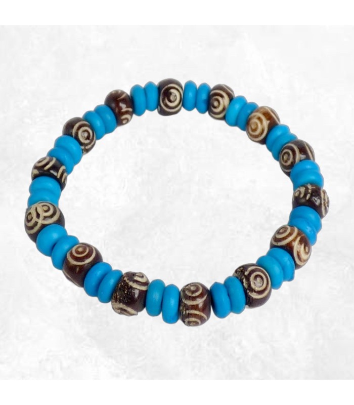 Bijou tibétain artisanal – Perles bleues et spirales symboliques