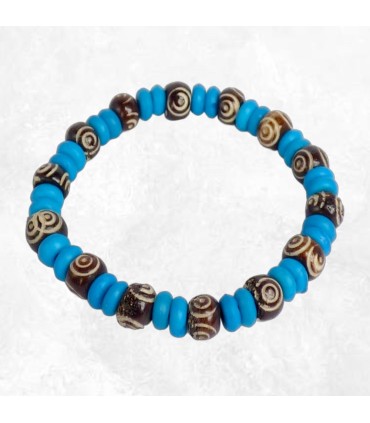 Bijou tibétain artisanal – Perles bleues et spirales symboliques