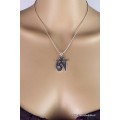 Pendentif tibétain avec le symbole OM Bijoux tibetains bouddhistes ref 2342